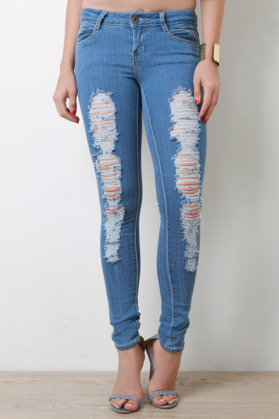 Distressed Mid Rise Skinny Jeans