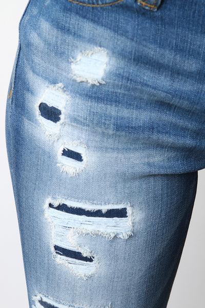 Mid Rise Undone Distressed Denim Jeans